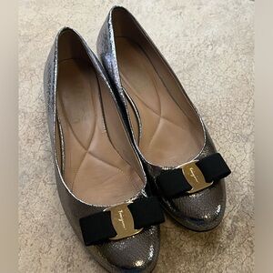 FERAGAMO AUTHENTIC FLATS- silver and gold&black bow. True side 7/7.5